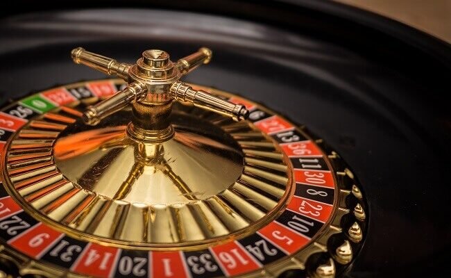 Modern roulette wheel with innovative gameplay features in a casino setting.